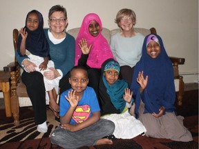 Back row, from left: Mariam, four; St. Thomas refugee committee head Marion Bulmer; Hamdi Abdile; Offerings writer Patricia Downing; Abdirahman, seven; Mushtak, nine; and Eklas, 11. Abdullahi was working out of town when this photo was taken.
