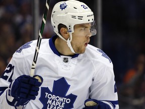 Toronto Maple Leafs left wing James van Riemsdyk reacts after scoring a goal in the first period of an NHL hockey game against the New York Islanders in Uniondale, N.Y., Tuesday, Oct. 21, 2014. (AP Photo/Kathy Willens)