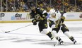 Pacific Division defenceman Drew Doughty (8), of the Los Angeles Kings, moves the puck against Central Division defenceman Dustin Byfuglien (33), of the Winnipeg Jets, during an NHL hockey All-Star semifinal round game Sunday, Jan. 31, 2016, in Nashville, Tenn. The Pacific Division won 9-6 to move onto the championship game.