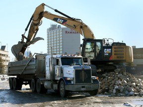 An excavator a dump truck on the Blatchford site on Jan. 29, 2015.