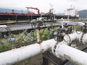 A ship receives its load of oil from the Kinder Morgan Trans Mountain Expansion Project's Westeridge loading dock in Burnaby, British Columbia, on June 4, 2015. The British Columbia government's final submission to the National Energy Board says it is unable to support Kinder Morgan's proposed pipeline expansion from Alberta to the West Coast.B.C.
