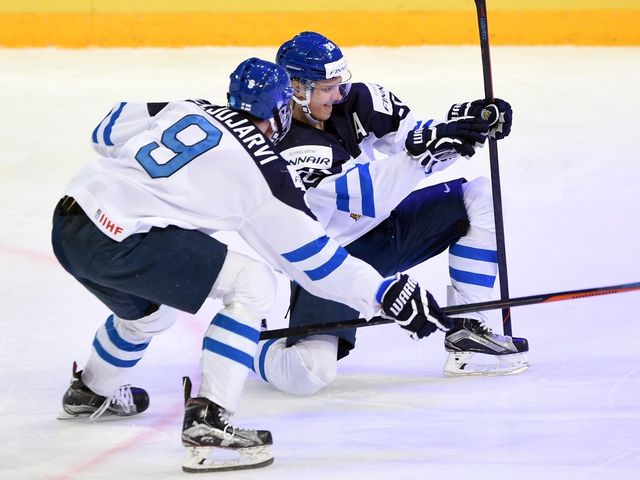 Finland's Sebastian Aho (right) celebrates his third period goal with teammate Jesse Puljujarvi during gold medal game hockey action at the IIHF World Championship, in Helsinki, Finland, on Tuesday, Jan. 5, 2016.