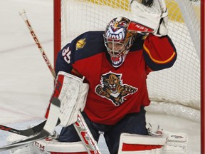 Florida Panthers goaltender Al Montoya (35) makes a glove save against the Minnesota Wild during the third period of an NHL hockey game, Sunday, Jan. 3, 2016,