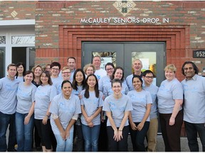 Members of the Alberta Blue Cross Hearts of Blue team volunteer at the McCauley Senior Centre.