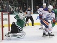 Stars goalie Antti Niemi cannot stop a shot from Edmonton's Teddy Purcell (not shown) as Oilers left-winger Taylor Hall (4) looks on during NHL action in Dallas on Thursday, Jan. 21, 2016. The Stars won 3-2.