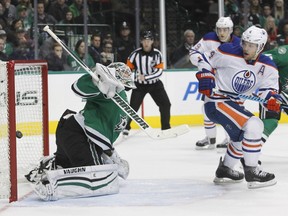 Stars goalie Antti Niemi cannot stop a shot from Edmonton's Teddy Purcell (not shown) as Oilers left-winger Taylor Hall (4) looks on during NHL action in Dallas on Thursday, Jan. 21, 2016. The Stars won 3-2.