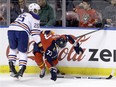 Florida Panthers centre Brandon Pirri (73) is checked by Edmonton Oilers defenceman Darnell Nurse (25) during the first period of an NHL hockey game, Monday, Jan. 18, 2016, in Sunrise, Fla.