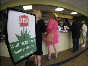 Buyers make their marijuana purchases at the counter in Denver, where Colorado law permits recreational marijuana use.