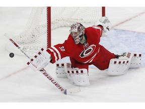 Carolina Hurricanes goaltender Cam Ward makes a save against the Ottawa Senators during the third period of an NHL hockey game in Raleigh, N.C., Saturday, Nov. 7, 2015.