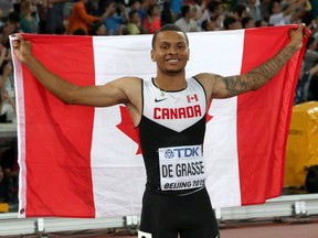 Canada's Andre De Grasse celebrates after winning the bronze medal in the men's 100 metres at the World Championships in Athletics at the Bird's Nest Stadium in Beijing, China, on Aug. 23, 2015.