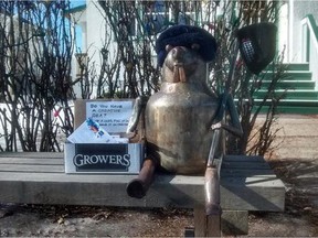 Susan and David Holdsworth's metal beaver on a bench in front of their Inglewood home. The bench and the beaver were stolen on Jan. 21 or 22.