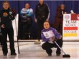 Team Rocque skip Kelsey Rocque, right, watches her rock stop dead on the button at the Alberta Scotties Tournament of Hearts at the North Hill Community Curling Club in Calgary on Wednesday, Jan. 20, 2016.