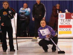 Team Rocque skip Kelsey Rocque, right, watches her rock stop dead on the button at the Alberta Scotties Tournament of Hearts at the North Hill Community Curling Club in Calgary on Wednesday, Jan. 20, 2016.