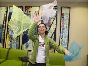 Annie Dugan from Firefly Theatre and Circus teaches people to juggle scarves Thursday at a kickoff event to celebrate the importance of diverse learning opportunities at the Edmonton Public Library.