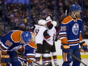 Edmonton Oilers' Brandon Davidson and Darnell Nurse skate away from the goal after the Arizona Coyotes scored during second period NHL action on Jan. 2, 2015, in Edmonton.