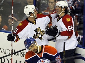 Florida Panthers' Jonathan Huberdeau (L) congratulates Jaromir Jagr for his first period goal as Edmonton Oilers' Darnell Nurse reacts during NHL action at Rexall Place in Edmonton January 10, 2016.