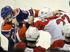Florida Panthers' Nick Bjugstad and Edmonton Oilers' Eric Gryba fight during an NHL game at Rexall Place on Jan. 10, 2016.