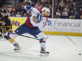 Brandon Baddock of the Edmonton Oil Kings battles Mitch Wheaton of the Brandon Wheat Kings for the puck during Friday's game at Rexall Place.