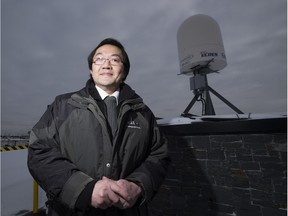Senior hydraulic engineer Steve Chan stands in front of the city's new radar weather system.