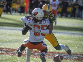 Edmonton Eskimos linebacker Dexter McCoil lays a ferocious hit on B.C. Lions' Shaquille Murray-Lawrence during a Canadian Football League game at Commonwealth Stadium on Sept. 26, 2015.
