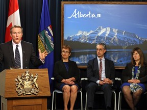 The Alberta government introduced the province's royalty review panel in Edmonton on August 28, 2015. They are (left to right) Dave Mowat, Annette Trimbee, Peter Tertzakian and Leona Hanson.