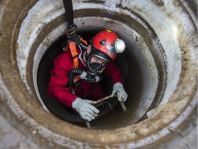 Dayna Knapton prepares to go down into a sewer line.