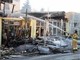 Firefighters put out hotspots on Jan. 13, 2015, during the fire that destroyed the historic Roxy Theatre at 124th Street and 107th Avenue in Edmonton.