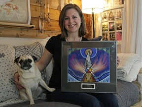 Renee Laporte, photographed at her Edmonton home with her dog Sake, recently won the 2015 Human Rights Award from the John Humphrey Centre for Peace and Human Rights for her work with high-risk teen girls.