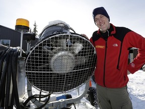 Dave Storey, a ski trail groomer at the Edmonton Nordic Ski Club, stands beside a new snow-making machine at Gold Bar Park in Edmonton.