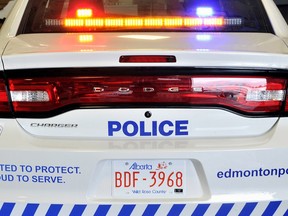 Edmonton police have charged a woman in connection with a collision in which a pedestrian was killed.