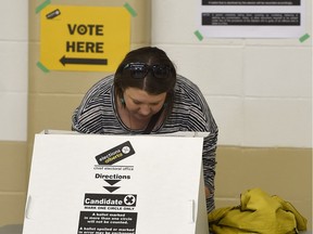 Amanda Bird marks her ballot in the provincial election at the polling station in Ritchie Community Hall on Tuesday, May 5, 2015.
