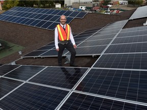Clifton Lofthaug, Owner of Great Canadian Solar Ltd., with the new solar panels on the roof of the Devon Community Centre in Devon on Wednesday, Sept. 9, 2015.