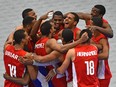 Cuba celebrates after defeating Canada in three straight sets in the final match of the NORCECA Continental Olympic qualification men's volleyball tournament at the Saville Community Sports Centre on Jan. 10, 2016.
