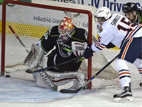 Kamloops Blazers left-winger Collin Shirley scores on a wrap-around against Edmonton Oil Kings goalie Payton Lee for the winning goal late in a Western Hockey League game at Rexall Place on Jan. 17, 2016.