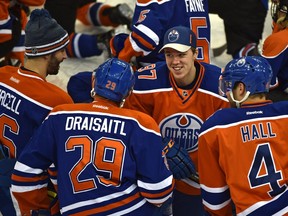 EDMONTON, ALTA: JANUARY 24, 2016 -- Connor McDavid talking to teammates during the Oilers Skills Competition at Rexall Place in Edmonton, January 24, 2016. This provides fans the opportunity to watch as their Oilers go head-to-head in competitions for fastest skater, accuracy, hardest shot, puck control relay, 3-on-3 and king of the shootout. (ED KAISER/PHOTOGRAPHER)