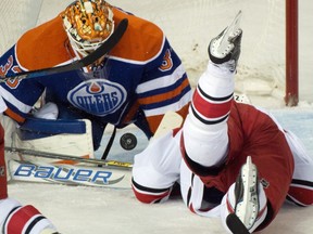 Edmonton Oilers goalie Cam Talbot makes a save with Eric Staal of the Carolina Hurricanes in the goal crease during a game at Rexall Place on Jan. 4, 2016. The Oilers will look to extend their win streak to three Friday when the Tampa Bay Lightning visits.