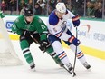 DALLAS, TX - JANUARY 21:  Mark Fayne #5 of the Edmonton Oilers skates against Antoine Roussel #21 of the Dallas Stars in the first period at American Airlines Center on January 21, 2016 in Dallas, Texas.