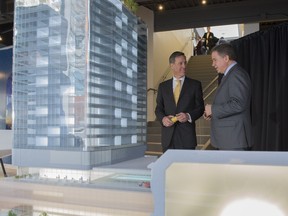 Arne Sorenson, president and CEO of Marriott International and Don Cleary, president of Marriott Hotels Canada, view the model of the newly announced JW Marriott Edmonton for ICE District opening in 2018.