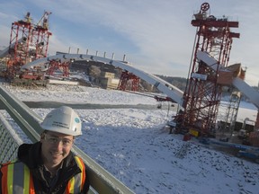 Ryan Teplitsky, construction project manager with the City of Edmonton, in front of the first of two arch segments which will be lifted Tuesday for the new Walterdale Bridge.