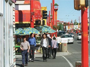 Pedestrians walk in Edmonton's Chinatown in 1999.