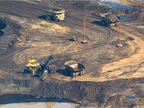 An aerial view of the 400 ton trucks and 100 ton electric rope shovels used at Suncor's Millennium Mine oilsands operation north of Fort McMurray.