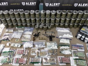 Four people associated to an organized crime group known as the Surrey Boys have been arrested following a series of ALERT raids in Grande Prairie. A significant amount of drugs and cash were seized, along with two handguns. Nearly a quarter million dollars‚Äô worth of drugs and cash proceeds of crime was seized as the result of search warrants being executed on Jan. 21, 2016.