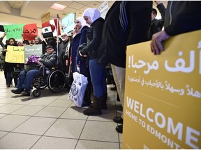 Syrian refugees being welcomed as they arrive at Edmonton International Airport in December 2015.