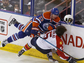 Matt Hendricks unloads on Aaron Ekblad with a booming check at Raxall Place on January 10. Hendricks received a three-game suspension.