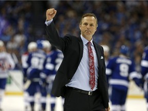 Tampa Bay Lightning head coach Jon Cooper celebrates a win over the Montreal Canadiens in the Eastern Conference semifinals during the 2015 Stanley Cup Playoffs at Amalie Arena in Tampa on May 12, 2015.