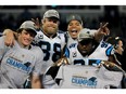 From left, Luke Kuechly, Greg Olsen, Cam Newton  and Charles Johnson of the Carolina Panthers celebrate defeating the Arizona Cardinals 49-15 to win the NFC Championship Game at Bank of America Stadium on Jan. 24, 2016.