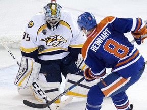 Edmonton Oilers defenceman Griffin Reinhart is stopped by Nashville Predators goalie Pekka Rinne during NHL action at Rexall Place in Edmonton on Jan. 23, 2016.