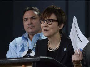 Assembly of First Nations National Chief Perry Bellegarde looks on as First Nations Child and Family Caring Society Executive Director Cindy Blackstock speaks about the Canadian Human Rights Tribunal regarding discrimination against First Nations children in care, during a Tuesday news conference in Ottawa.