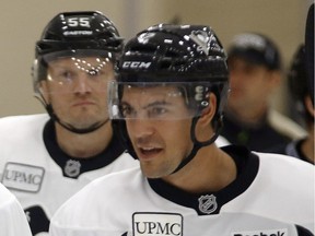 Adam Clendening (right) and Sergei Gonchar (left) warm up during the Pittsburgh Penguins' NHL hockey training camp on Sept. 18, 2015, in Cranberry Township, Pa.
