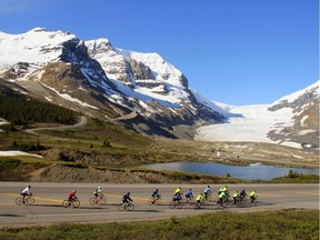 Nick Lees' cycling group, seen here riding by Mt. Athabasca on the Icefields Parkway, will ride this June to raise $500,000 to help build a new CASA Centre.